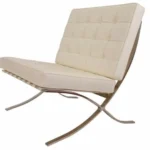 Side view of the cream Barcelona chair showing the crossed 12 mm steel frame