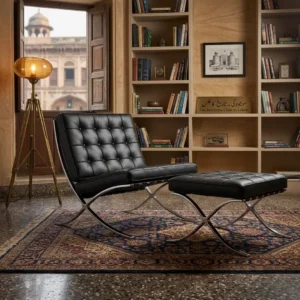 Side view of the black Barcelona chair showing the crossed 12 mm steel frame