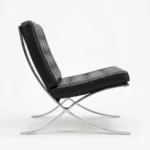 Close-up of tufted black Italian leather cushions and stitching on the Barcelona chair