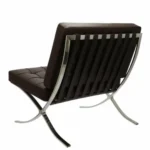 Side view of the brown Barcelona chair showing the crossed 12 mm steel frame