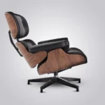 Back view of the walnut veneer shell on the black leather mid century armchair