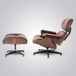 Brown mid century modern armchair and ottoman beside a grey sofa in a warm living room
