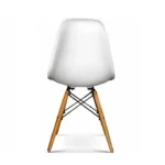 Side view of the white DSW dining chair showing the moulded shell profile