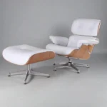 Eames lounge chair in blonde ashwood and white leather on a polished chrome base with matching ottoman