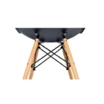 Side view of the black DSW dining chair showing the moulded shell profile