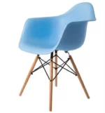 Light blue Eames DAW arm chair styled in a modern dining room