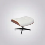 Close-up of welted white leather cushion beside rosewood veneer grain