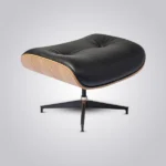 Black leather ashwood lounge chair and ottoman in a modern monochrome interior