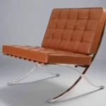 Close-up of tufted tan brown Italian leather cushions and stitching on the Barcelona chair