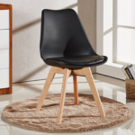 Close-up detail of black upholstered seat pad and matte finish shell
