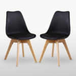 Side angle of sleek black mid-century modern tulip dining chair