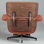 Back view of the walnut veneer shell on the tan leather mid century chair