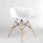 Close-up of white Eames DAW chair seat and armrest detail