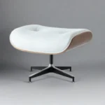Side profile of the white leather walnut lounge chair showing the reclined seat and headrest
