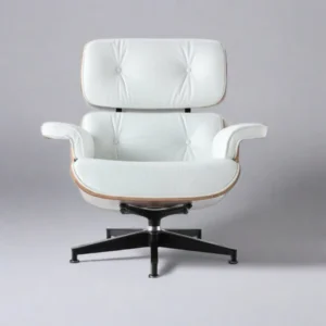 Close-up of welted white leather cushion panels and walnut veneer on the lounge chair