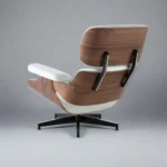 Close-up of the five star swivel base beneath the white leather lounge chair